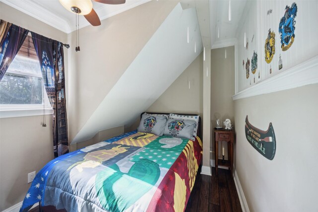 bedroom featuring ceiling fan, dark wood-type flooring, and ornamental molding