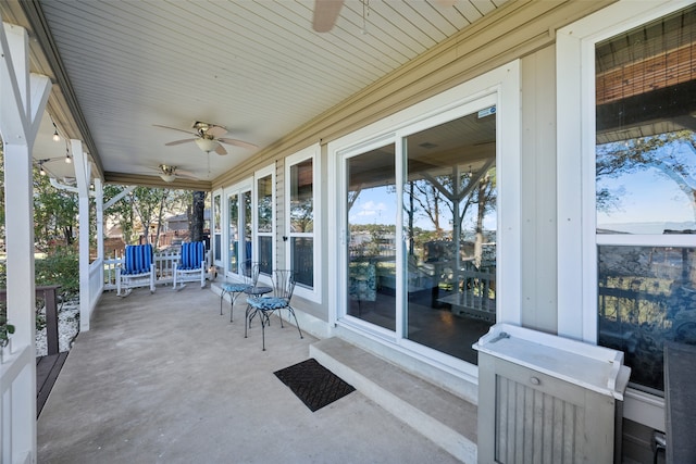 view of patio / terrace with ceiling fan and a porch