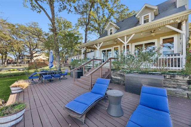 wooden deck with ceiling fan