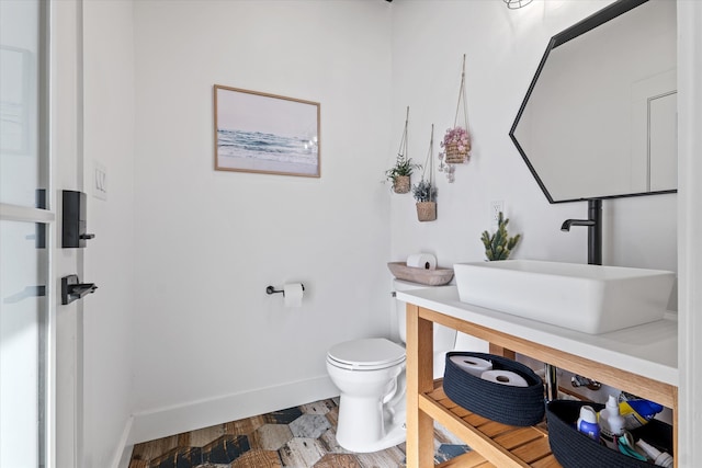 bathroom featuring sink and toilet