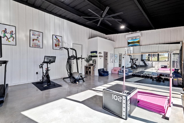 exercise room featuring an AC wall unit