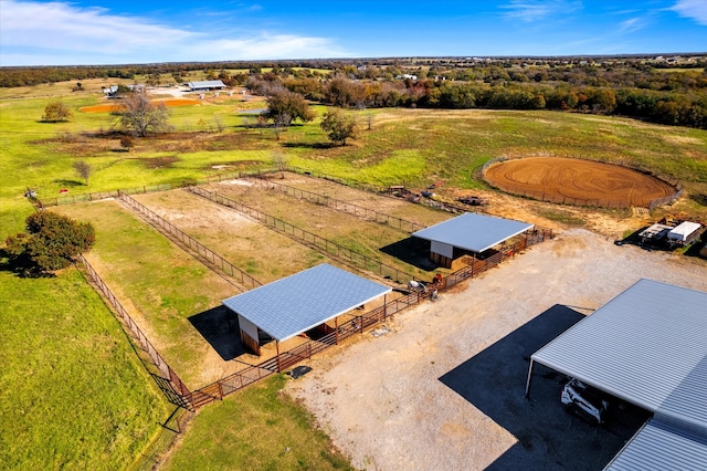 birds eye view of property with a rural view