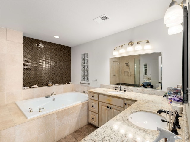 bathroom featuring vanity, tile patterned floors, and independent shower and bath