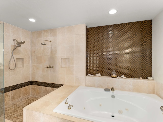 bathroom featuring separate shower and tub