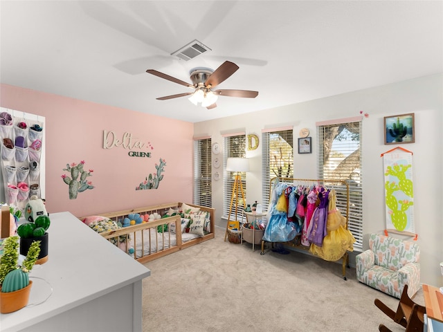 bedroom with ceiling fan and light colored carpet