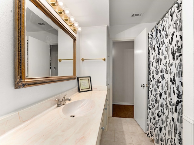 bathroom featuring tile patterned flooring, vanity, and a shower with shower curtain