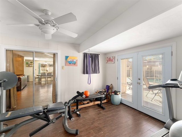 workout area with dark hardwood / wood-style flooring, ceiling fan, and french doors