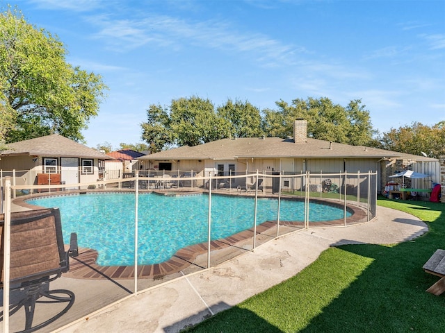 view of swimming pool with a patio