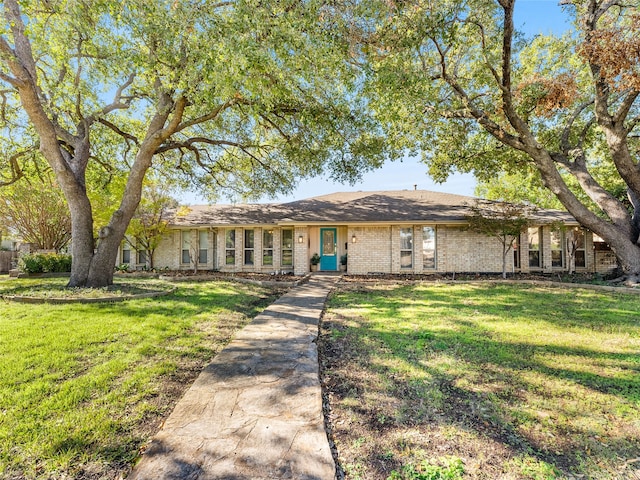 ranch-style house with a front lawn