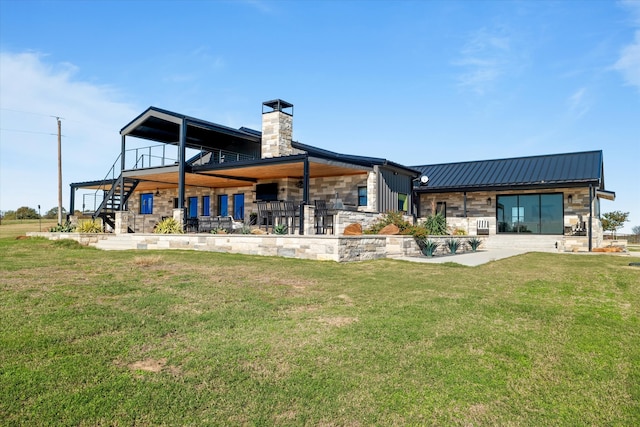 back of house with a lawn and a bar