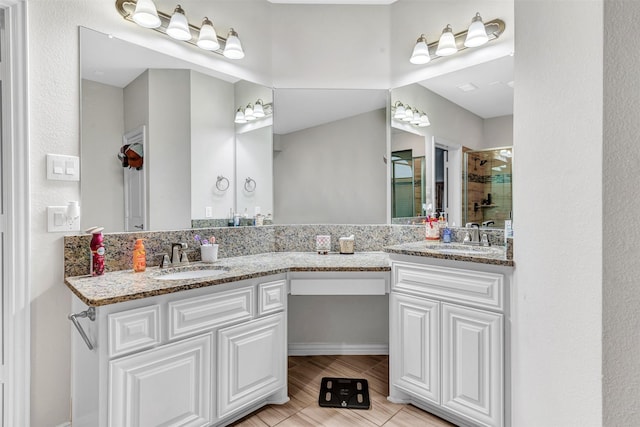 bathroom featuring an enclosed shower, tile patterned floors, and vanity