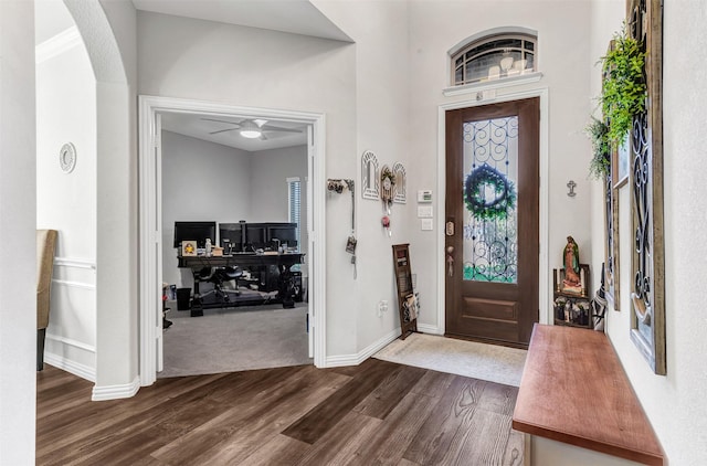 foyer featuring vaulted ceiling, ceiling fan, hardwood / wood-style flooring, and ornamental molding