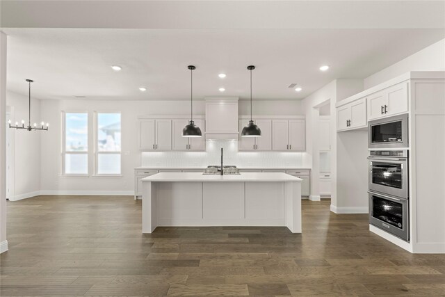 3304 Andesite Rd, Mckinney, TX 75071 - kitchen featuring built in microwave, backsplash, a chandelier, stainless steel double oven, and light countertops