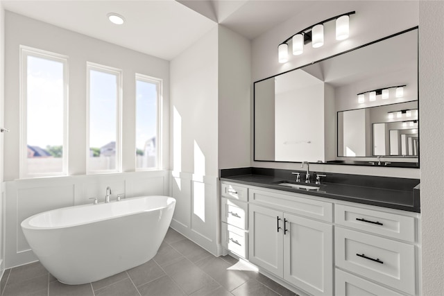 3304 Andesite Rd, Mckinney, TX 75071 - bathroom featuring a freestanding tub, vanity, tile patterned flooring, and recessed lighting