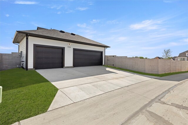 3304 Andesite Rd, Mckinney, TX 75071 - view of side of home featuring concrete driveway and roof with shingles