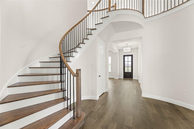 3304 Andesite Rd, Mckinney, TX 75071 - foyer with stairway, baseboards, wood finished floors, and a towering ceiling