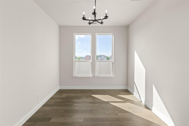 3304 Andesite Rd, Mckinney, TX 75071 - unfurnished dining area featuring a chandelier, dark wood finished floors, and baseboards