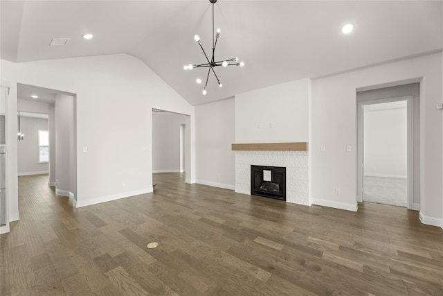 3304 Andesite Rd, Mckinney, TX 75071 - unfurnished living room with lofted ceiling, a chandelier, a tile fireplace, dark wood finished floors, and baseboards