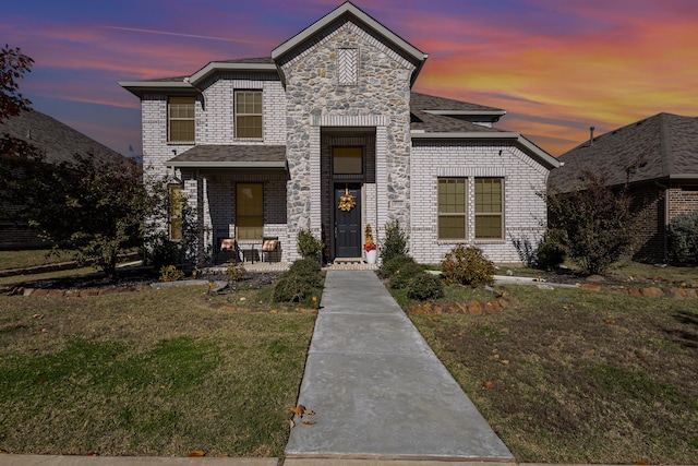 view of front of house with a lawn