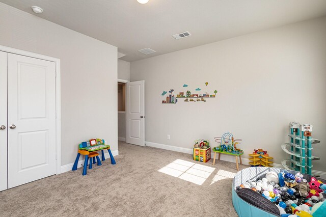 game room featuring light colored carpet