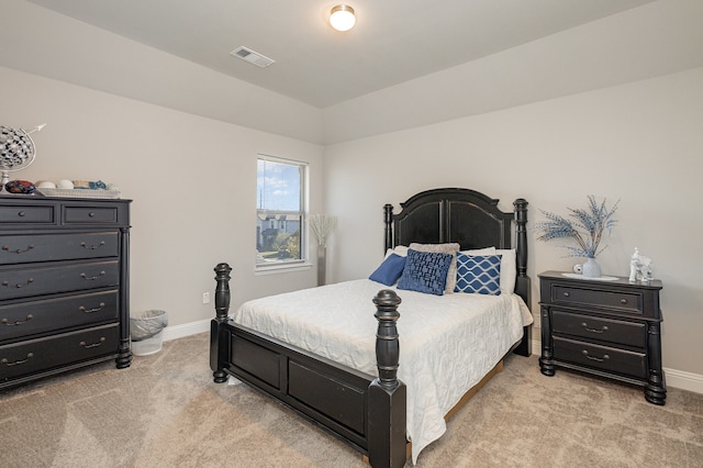 bedroom featuring light carpet