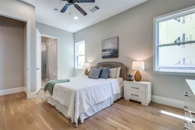 bedroom featuring light hardwood / wood-style floors and ceiling fan