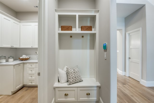 mudroom with light hardwood / wood-style flooring