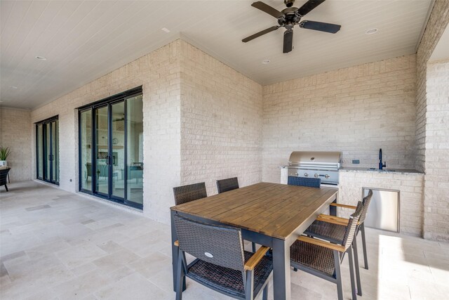 view of patio / terrace with sink, area for grilling, ceiling fan, and a grill