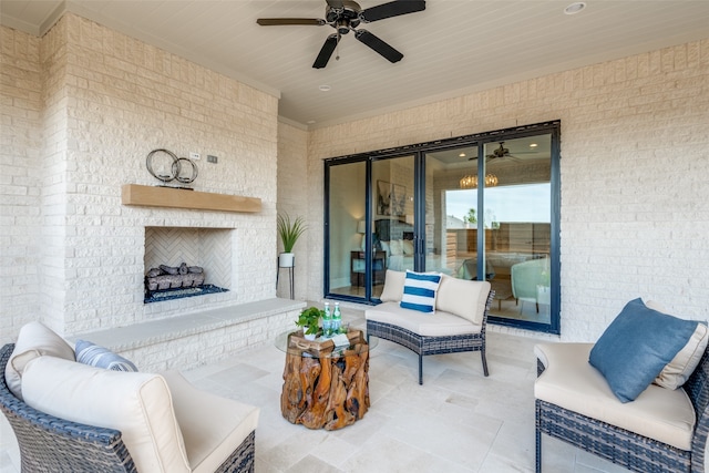 view of patio featuring an outdoor brick fireplace and ceiling fan