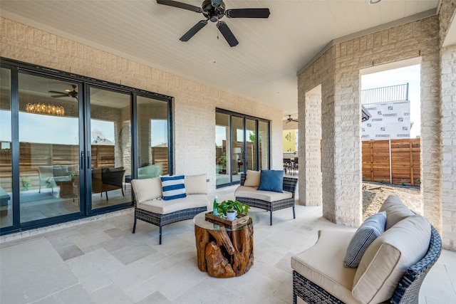 view of patio with outdoor lounge area and ceiling fan