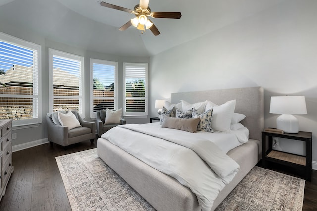 bedroom with ceiling fan, dark hardwood / wood-style flooring, and lofted ceiling