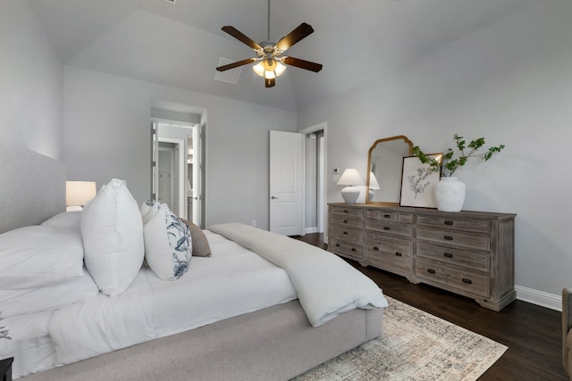 bedroom featuring dark hardwood / wood-style floors, ceiling fan, and lofted ceiling