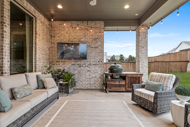 view of patio / terrace featuring an outdoor hangout area and a grill