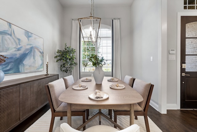 dining area featuring radiator and dark wood-type flooring