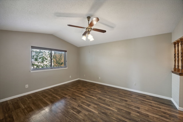 unfurnished room featuring a textured ceiling, dark hardwood / wood-style floors, vaulted ceiling, and ceiling fan