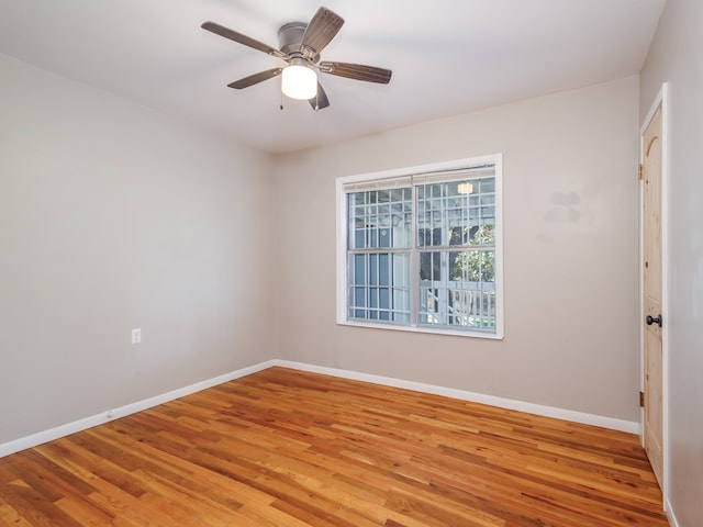 empty room featuring ceiling fan and light hardwood / wood-style flooring