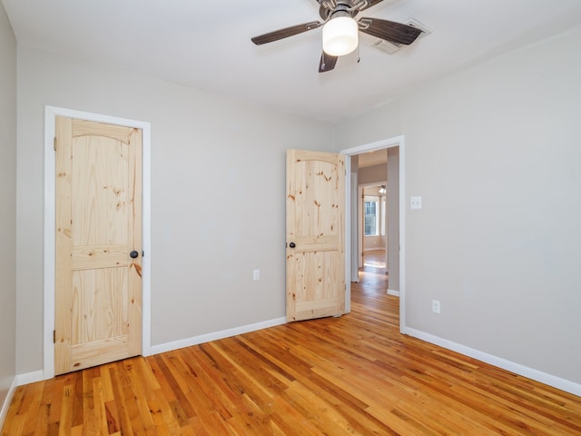 unfurnished bedroom featuring light hardwood / wood-style flooring and ceiling fan