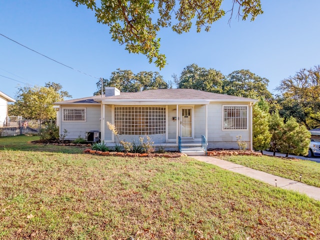 ranch-style home with a front lawn