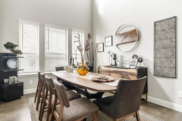 846 Belltown Dr, Allen, TX 75013 - dining space featuring baseboards, wood finished floors, and a towering ceiling