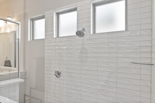 bathroom with a tile shower