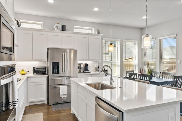 846 Belltown Dr, Allen, TX 75013 - kitchen with a sink, appliances with stainless steel finishes, backsplash, healthy amount of natural light, and recessed lighting