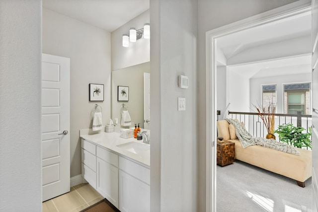 bathroom with vanity, tile patterned floors, and ensuite bathroom