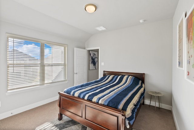 bedroom with carpet flooring, baseboards, and lofted ceiling