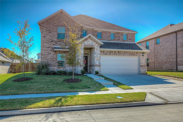 view of front of home with a front yard and a garage