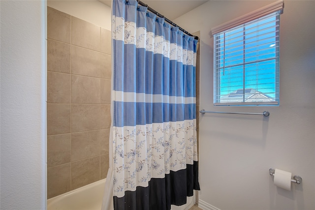 bathroom featuring shower / bath combination with curtain