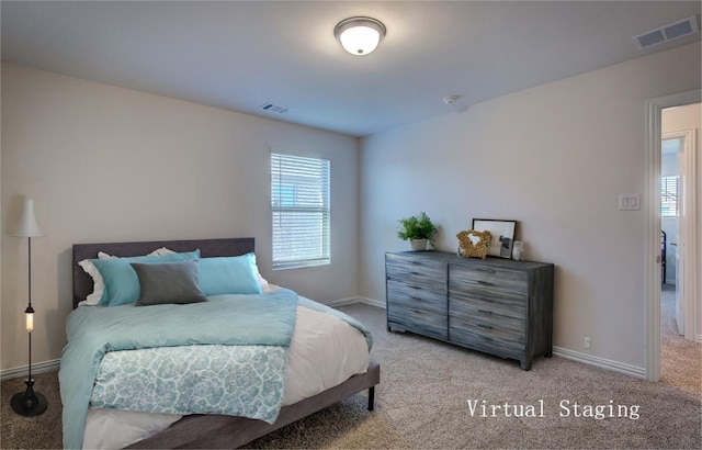 bedroom featuring carpet flooring and multiple windows