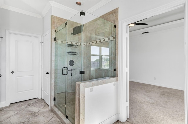 bathroom with ornamental molding and an enclosed shower