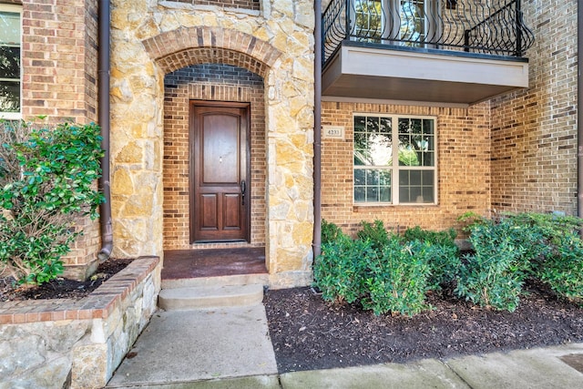 doorway to property featuring a balcony