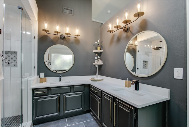 bathroom with vanity, tile patterned floors, and a shower with shower door