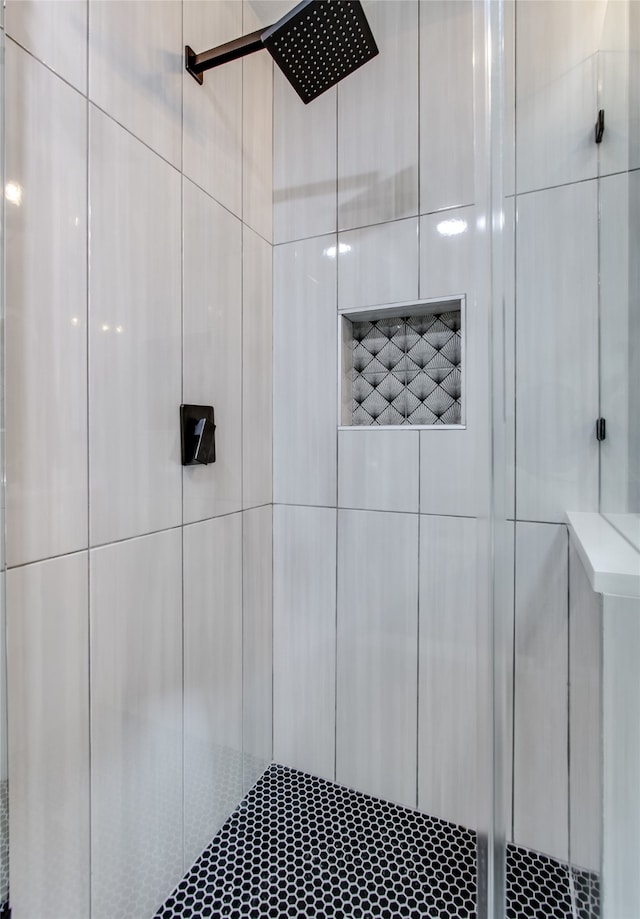 bathroom with tiled shower